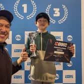 Proud dad Bill Lai and his son Nico, 11, who is celebrating qualifying for the national finals of the British Indoor Karting Championship – which take place next month (Photo: Submitted)
