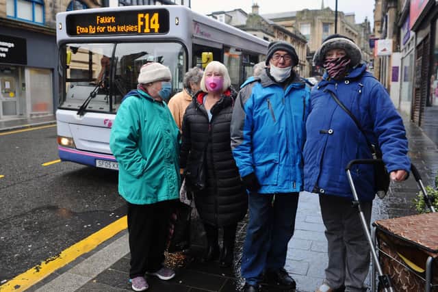 Helen Flynn wearing a pink mask with other bus users pictured six months ago (Pic: Michael Gillen)