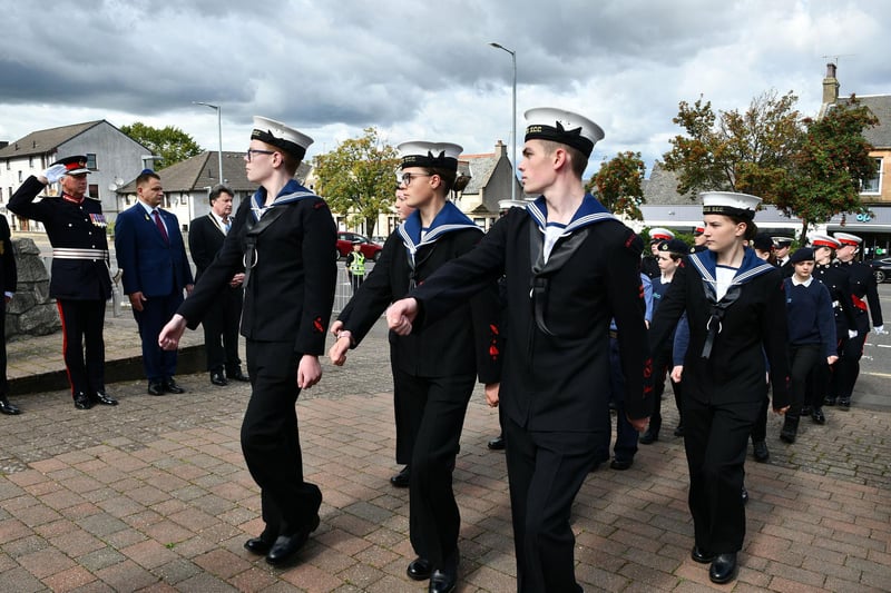 Sea cadets march to the war memorial.