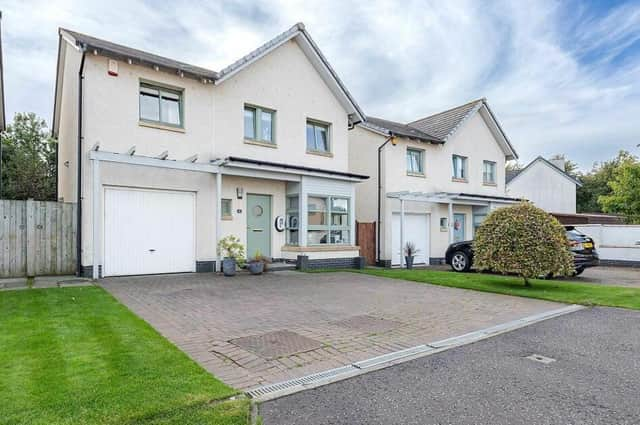 Built by Ogilvie Homes in the early 2000s, this home is warm and welcoming - inside and out.