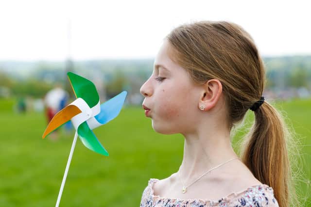 Evelyn Henson tests out her windmill at the 2024 STEM@The Helix event.  (Pic: Mark Ferguson)