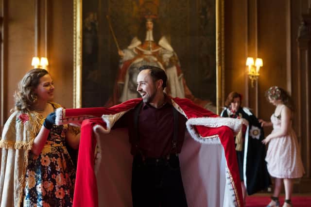 Holyrood Club dressed in 1950s clothes pose around Holyrood Palace,Edinburgh Photograph: David Cheskin