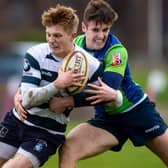 Heriot's Harry Paterson being tackled by Boroughmuir Bears' Glen Faulds during a Super6 game at Goldenacre in Edinburgh in January last year (Photo: Ross MacDonald/SNS Group/SRU)