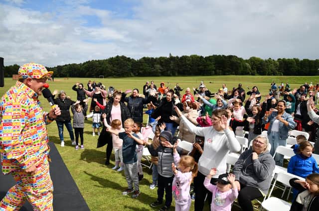 Magic Malky engages with the crowd at Mariners' Fun Day