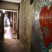 A heart with NHS written on it on the wall of a quiet alleyway in Edinburgh (Photo credit: Andrew Milligan/PA Wire).