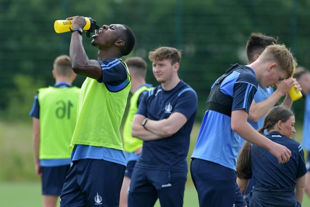 Alfredo Agyeman takes on water during a break