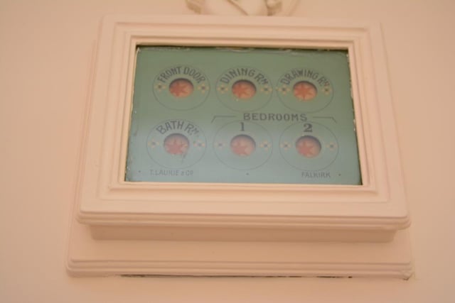 The dining room features an original bell-board in working condition.