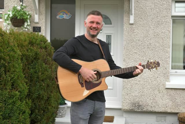 27-04-2020. Picture Michael Gillen. DENNY. Day 35 of UK wide coronavirus lockdown. Singer Liam McGrandles and wife Fiona McGrandles held a front garden Facebook Live gig at their home in Denny, raising over £5100 for two food banks.