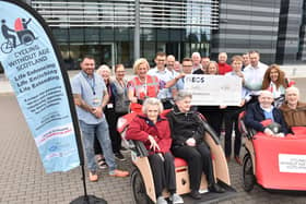 Representatives from Cycling Without Age Scotland receive a £1000 donation from INEOS staff who took part in a Tour De France challenge. (Pic: submitted)