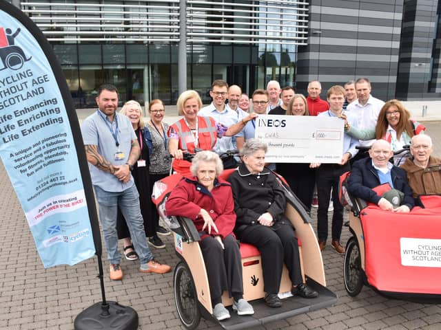 Representatives from Cycling Without Age Scotland receive a £1000 donation from INEOS staff who took part in a Tour De France challenge. (Pic: submitted)