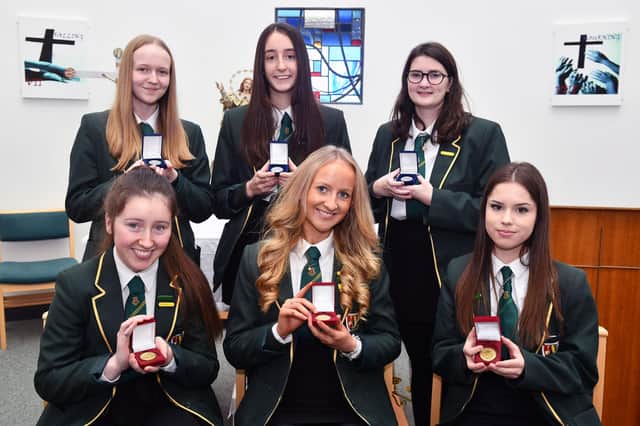Pictured back row: Junior proxime accessits Kimberley Crawford, Jess Mooney and Amy Callaghan. Front row: Junior duxes Molly McGhee, Amy Millar, and Timea Csicsvakova. Not pictured Megan Donaldson, junior proxime accessit.