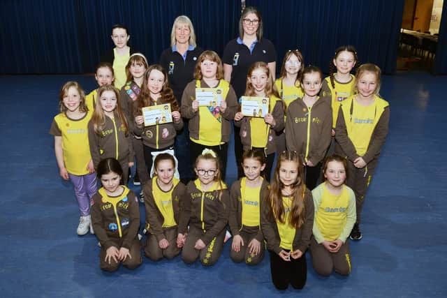 Members of the 11th Falkirk Brownies including Isla Nelson, Eleanor Morrison and Rosie Feeney with their awards certificates.  (Pic: Michael Gillen)