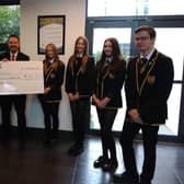 Grangemouth High School pupils Sophie Morrison and Hollie Anderson pictured with depute headteacher Ash Wood and the new school captains Abby Laurie, Lucy Morrison, Ciara Mulhall and Fred Wilson. Picture: Other 3rd Party.