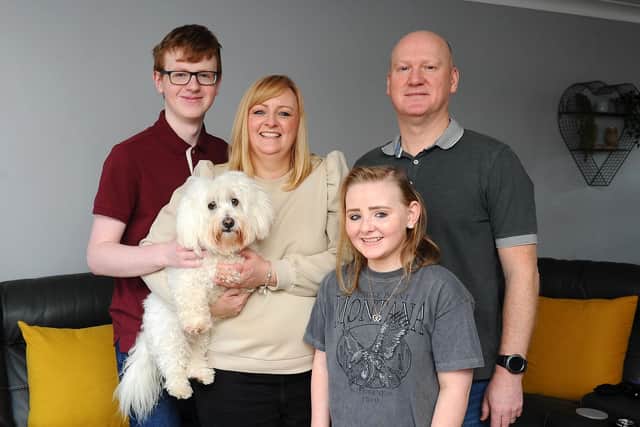 Ashlee Easton with brother Jayden, dog Angel, mum Lisa and dad Donald. Picture: Michael Gillen.