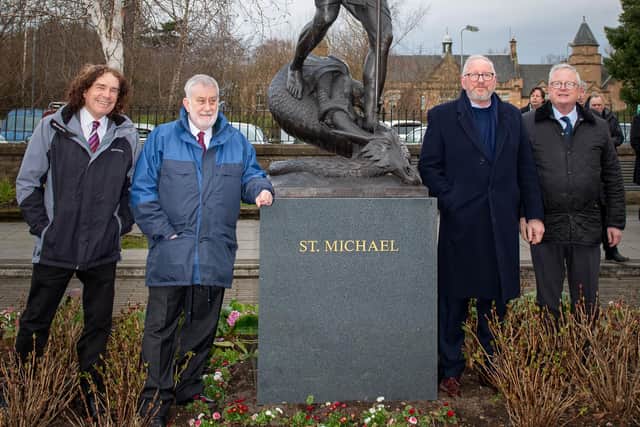 Left to right: Ron Smith (Burgh Trust and Burgh Beautiful), Councillor Tom Conn, St Michael and dragon, Alan Herriot the sculptor and Joseph Morrow, Lord Lyon King of Arms. Photo by John Buckley.