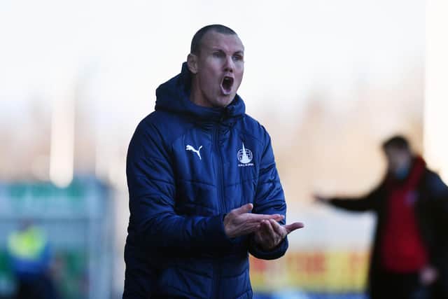 Assistant coach Kenny Miller on the touchline