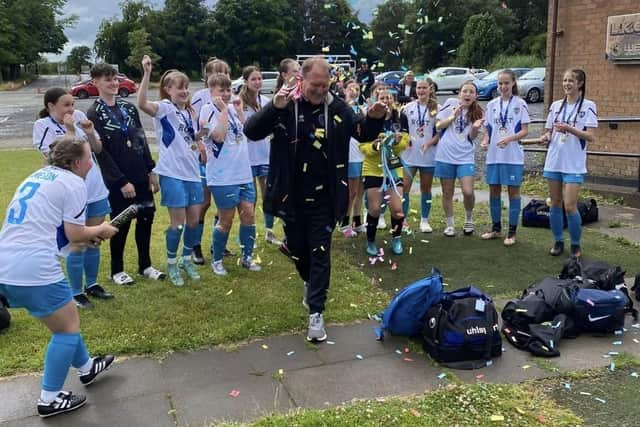 Head coach Ian Dibdin enjoys the moment with his team after the match against Riverside (Photo: Submitted)