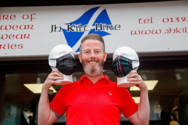 Jim Healy of JH Kilt Hire in Grangemouth is selling tartan face coverings, with £2 of each sale going to Strathcarron Hospice. Picture: Scott Louden.