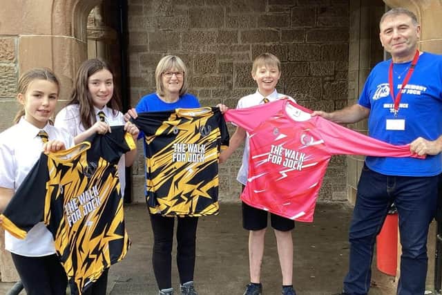 Davie was delighted to present pupils with their new football tops.