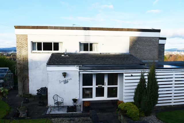 Officers had to break into the house in Main Street, Redding, near Falkirk, where they found the bodies of an 84-year-old man and an 82-year-old woman. Pic: Michael Gillen