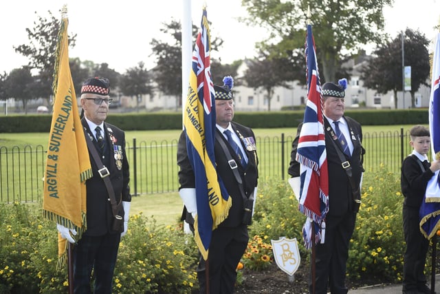 Flag bearers at the remembrance service at Bainsford War Memorial on Saturday.