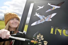 Artist Donna Forrester gets to work creating an RAF mural in the middle of Inchyra Park