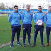 Stenhousemuir boss Stephen Swift pictured with his backroom team after winning the Glen's Manager of the Month award for cinch League 2 (Pic: 3x1 Group)