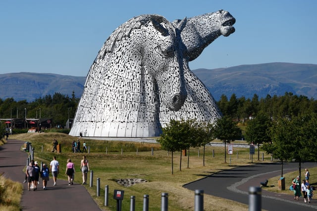 There's not a cloud in the sky as famlies - and the world-famous Kelpies - enjoy the summer sunshine