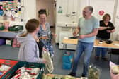 Councillor Andrew Miller with volunteers at the Vennie food outlet.