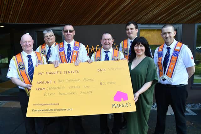 Cheque presentation of £2000 from Grangemouth Orange and Purple Defenders LOL187 for Maggie's Forth Valley.  Pictured: SM Michael Myles; Secretary PM Jim Cummings; Treasurer Ricky Alves; WM John Gibson; DM Alistair Douglas; Cristina Pouso, fundraising manager Maggie's Forth Valley and Ted Pearson member. Pic: Michael Gillen