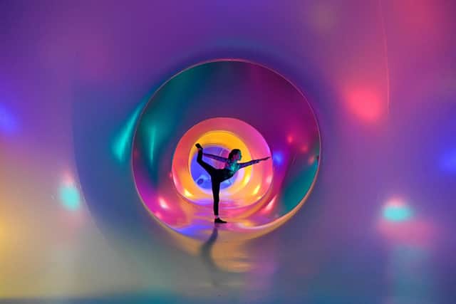 Sophia McMahon, aged 11, enjoys the atmosphere inside the art installation featuring dazzling maze of winding paths and domes. Pic: Julie Howden