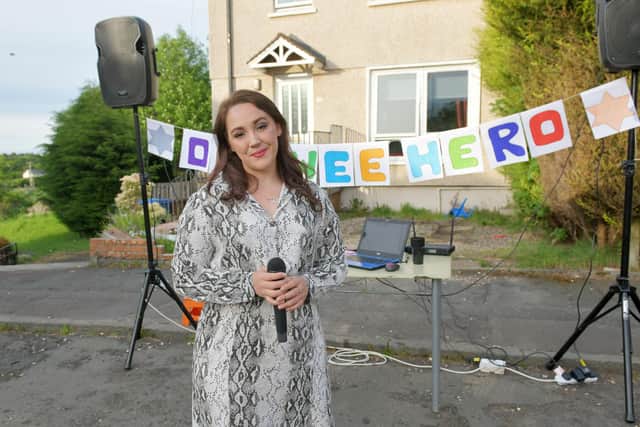Maddiston singer Carrieanne Craig has been entertaining neighbours and doing Facebook karaoke shows to keep spirits up during the coronavirus lockdown. Picture: Michael Gillen.