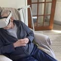 Kenny Brawley with the VR headset that allowed him to 'go back' to his favourite holiday spot.  (Pic: Strathcarron Hospice)