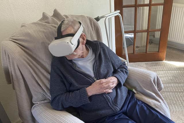 Kenny Brawley with the VR headset that allowed him to 'go back' to his favourite holiday spot. (Pic: Strathcarron Hospice)