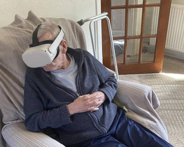 Kenny Brawley with the VR headset that allowed him to 'go back' to his favourite holiday spot.  (Pic: Strathcarron Hospice)