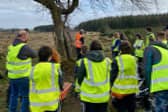 Volunteers getting their health and safety talk prior to undertaking path clearance.