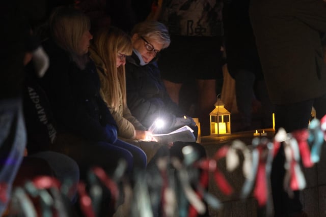 The service saw people light candles, tie ribbons with messages and hear readings.