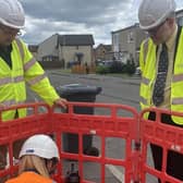 East Falkirk MP Martyn Day, right, joins Openreach engineers on site
