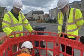East Falkirk MP Martyn Day, right, joins Openreach engineers on site
