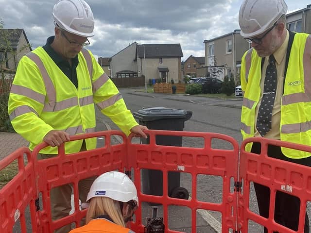 East Falkirk MP Martyn Day, right, joins Openreach engineers on site