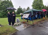 Reverend Andrew Moore with the Strathcarron Singers at a memorial service to mark a paupers' grave in Larbert. Picture: Contributed