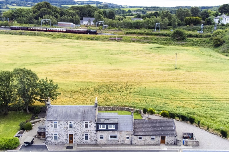 The aerial view shows its rural setting.