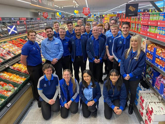Scott Woodburn, from Falkirk, pictured with colleagues from Aldi's Hermiston Gate store.   (Pic: Aldi)