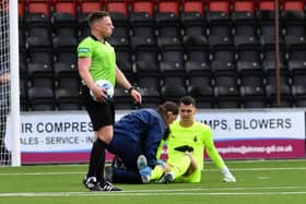 PJ Morrison receives treatment after injury at Airdrieonians in August
