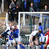 Tom Lang heads in the opener for Falkirk at Queen of the South (Pics by Michael Gillen)