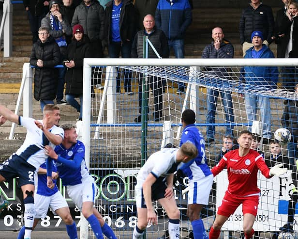 Tom Lang heads in the opener for Falkirk at Queen of the South (Pics by Michael Gillen)