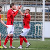 Blair Alston celebrates Falkirk's second goal with Callumn Morrison and Aidan Keena