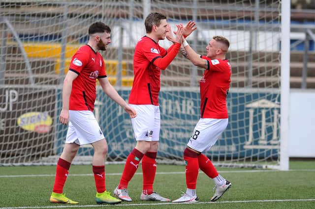 Blair Alston celebrates Falkirk's second goal with Callumn Morrison and Aidan Keena