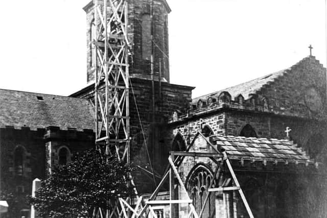 The Dollar Bells are raised to the Trinity belltower in 1926.