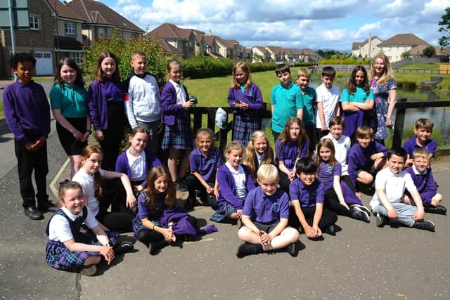 Kinnaird Primary School's P5L class, led by Ms Caryll Jack, has launched a campaign designed to tackle littering and an issue with tied and discarded bags of dog faeces in the Larbert area. Picture: Michael Gillen.